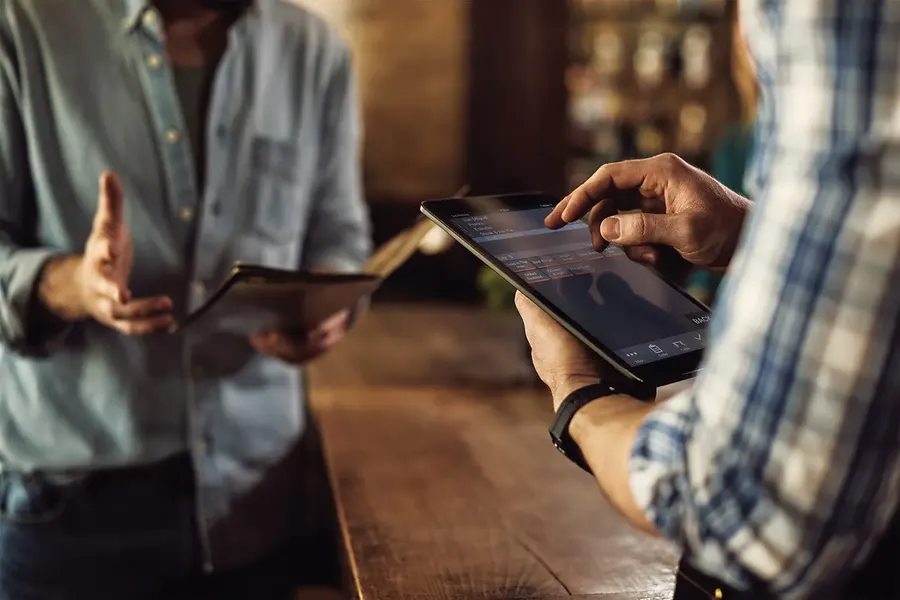 Staff taking orders on tablets